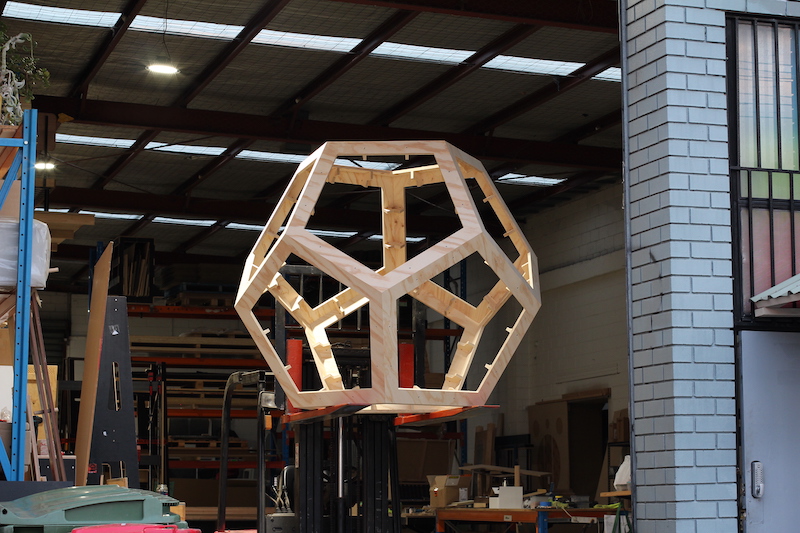CNC cut plywood dodecahedron standing in the workshop